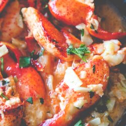 garlic butter lobster in a skillet