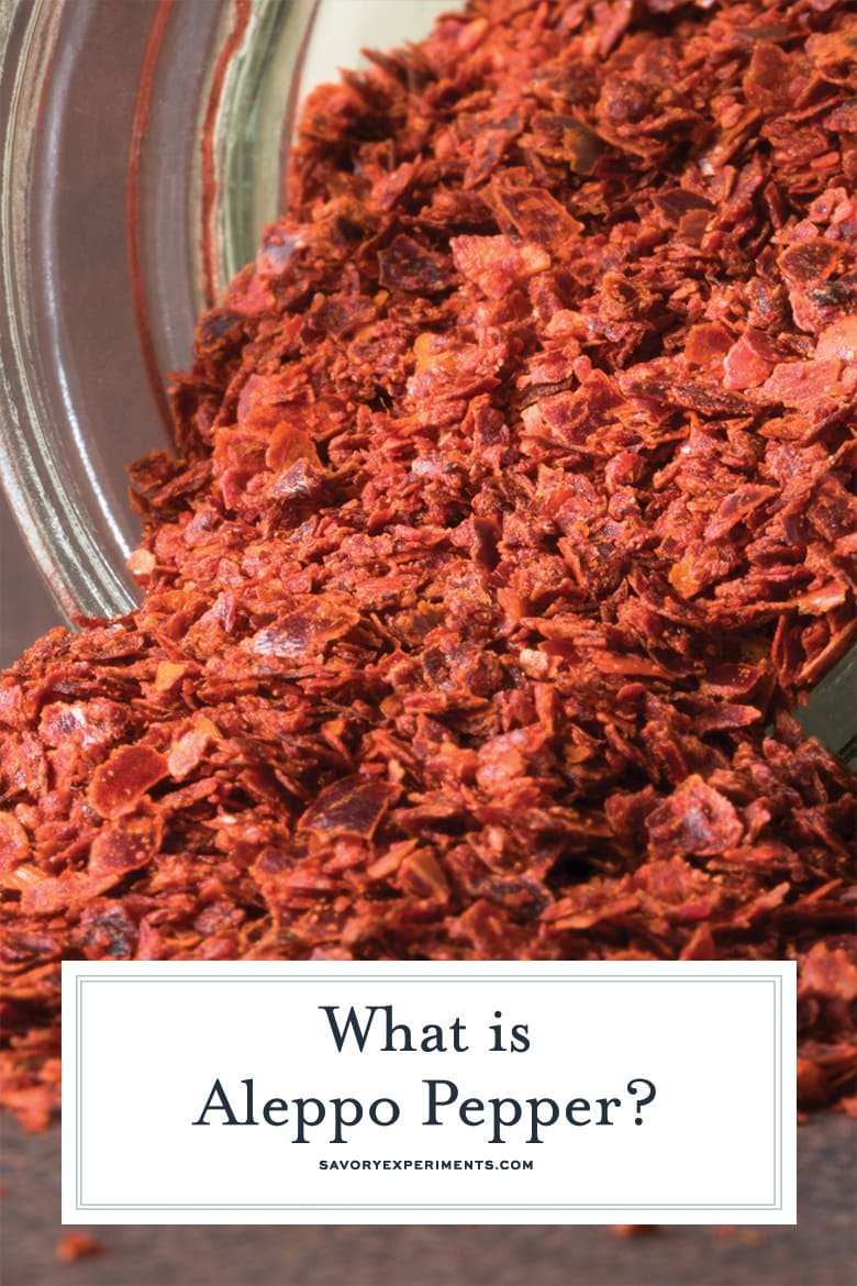 aleppo pepper pouring from a glass jar 