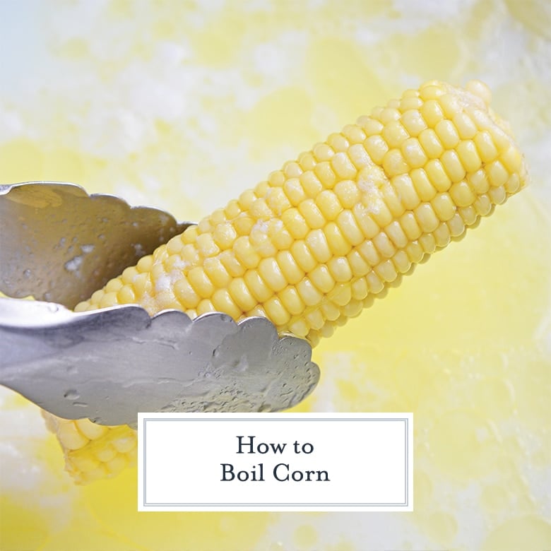 tongs holding an ear of corn