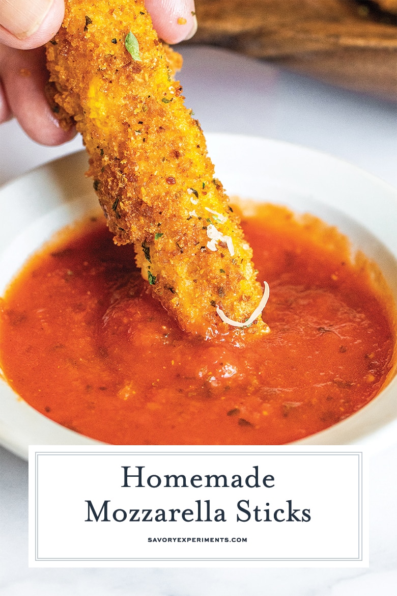 fried mozzarella dipping into tomato sauce