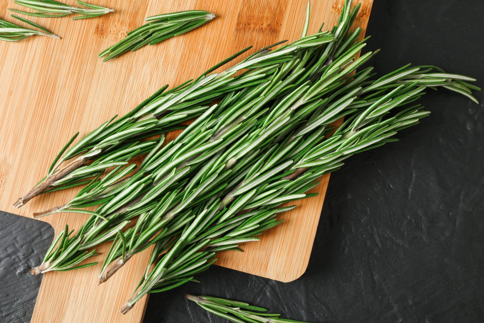 fresh rosemary on a cutting board