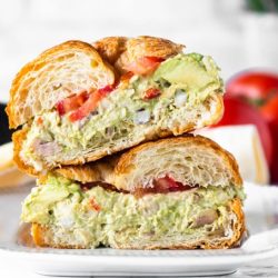 avocado chicken salad sandwich cut in half