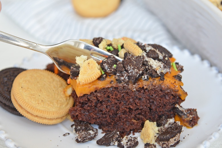 fork digging into poke cake 