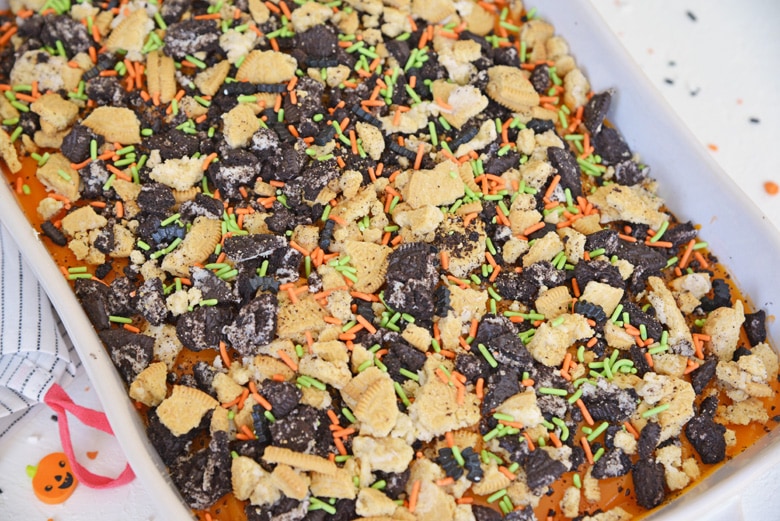 overhead of halloween poke cake with sprinkles 
