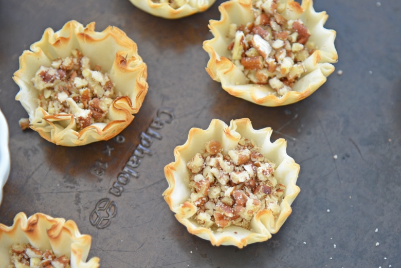 chopped pecans in tart shells