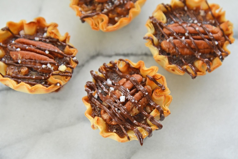 pecan tarts on marble background