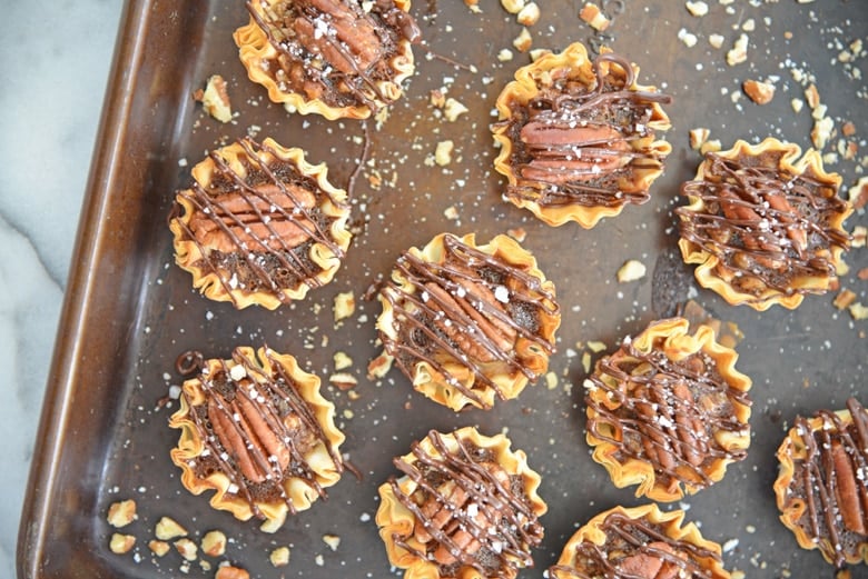 pecan pie drizzled with chocolate and salt 