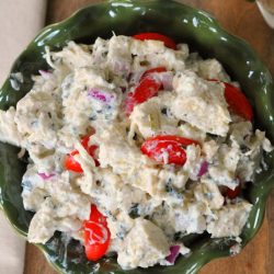 overhead shot of chicken salad in green bowl