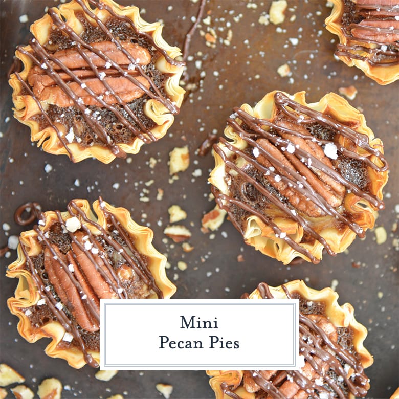 close up of mini pecan pies on a baking sheet 