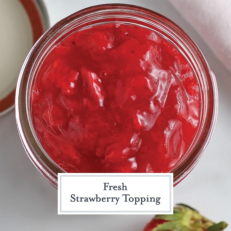 overhead of strawberry sauce in a glass jar
