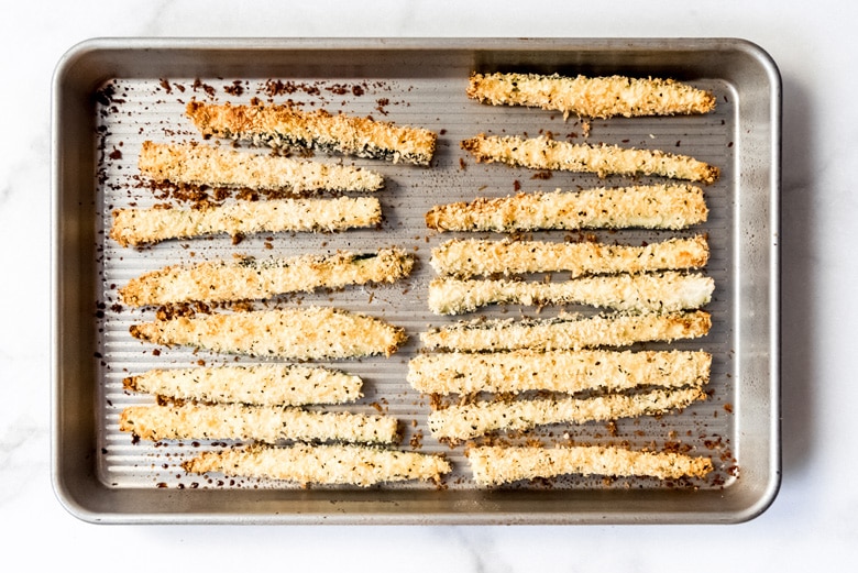 crunchy zucchini fries on a baking sheet 