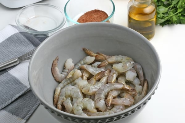 oiled shrimp in a mixing bowl