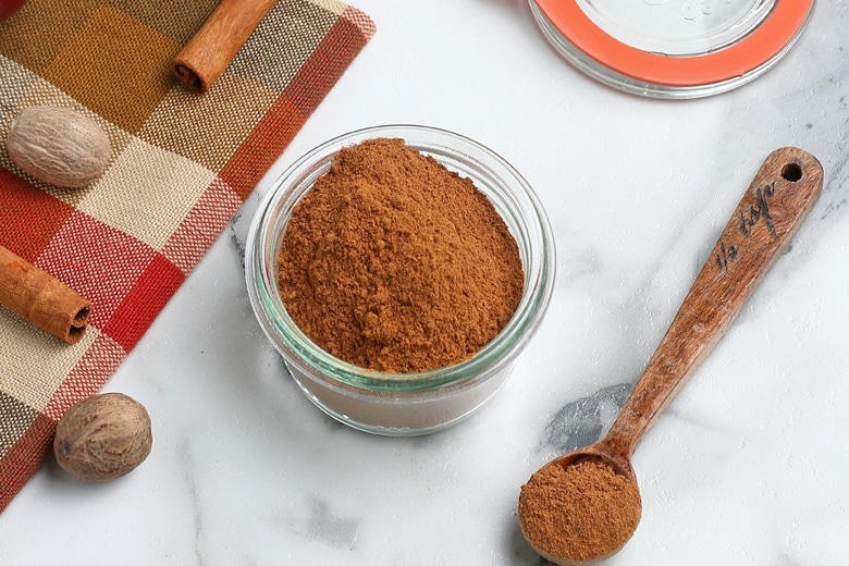 glass container with homemade apple pie spice 