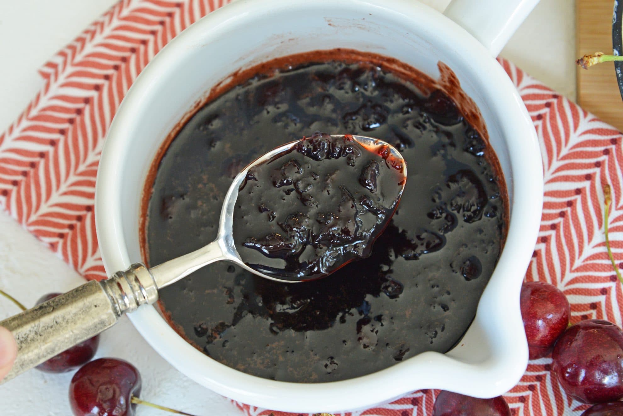 spooning cherry balsamic sauce