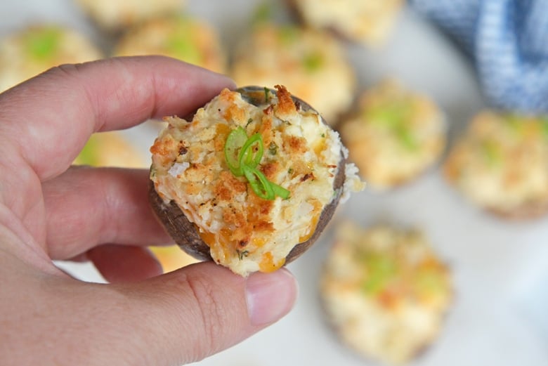 hand holding a stuffed mushrooms