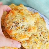 hand reaching for everything cheesy biscuit