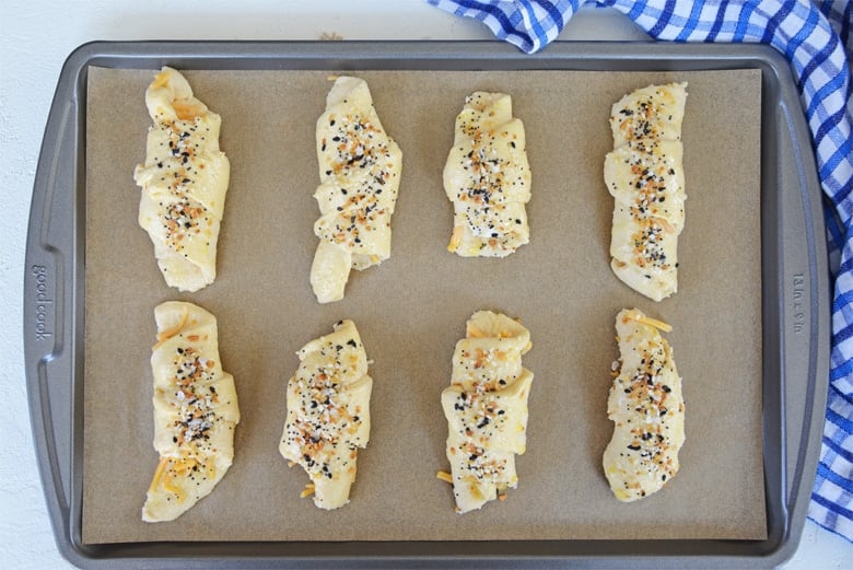 unbaked crescent rolls on a baking sheet 