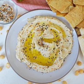 overhead of hummus with olive oil and everything seasoning