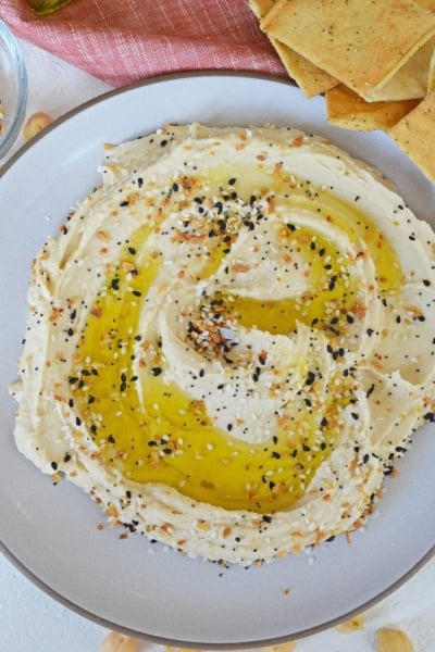 overhead of hummus with olive oil and everything seasoning