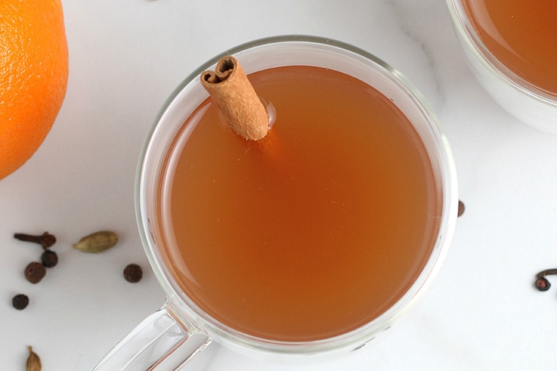 close up of mulled cider in a glass mug 