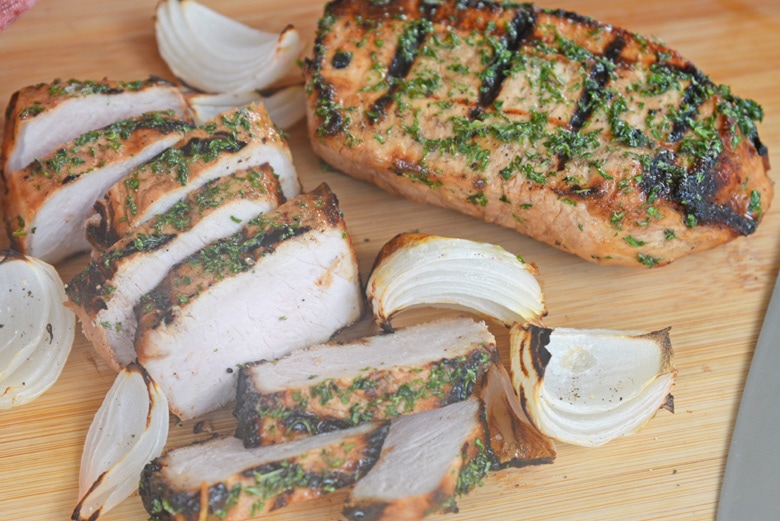 overhead of onion grilled pork chops