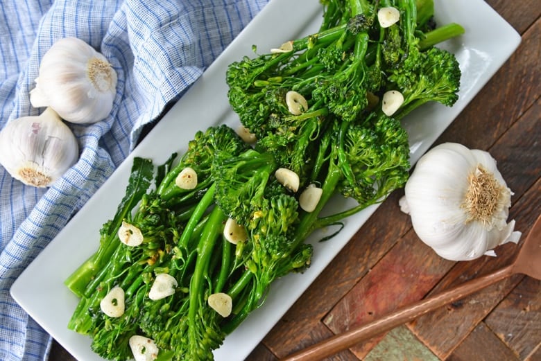 overhead of fried broccolini on a platter 