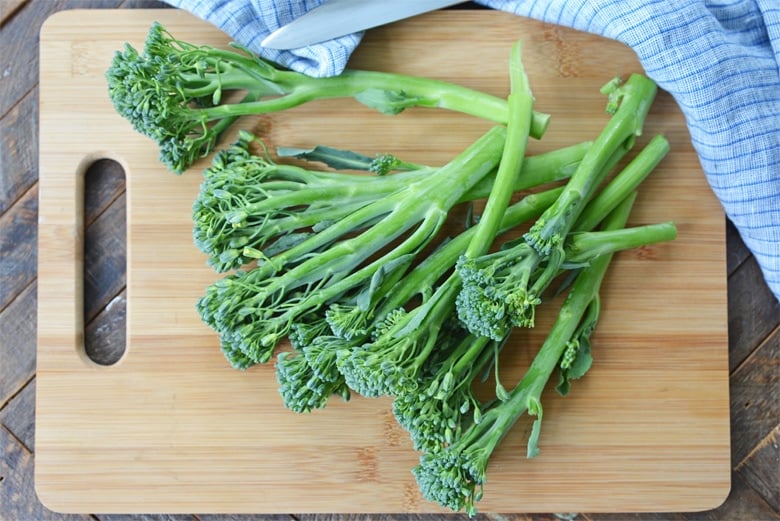 broccolini on a cutting board
