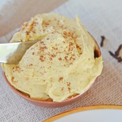 knife dipping into cream cheese spread