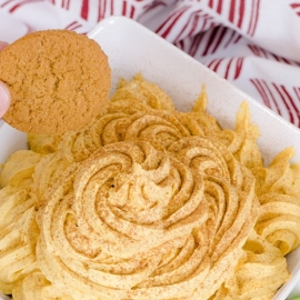 gingersnap dipping into pumpkin dip