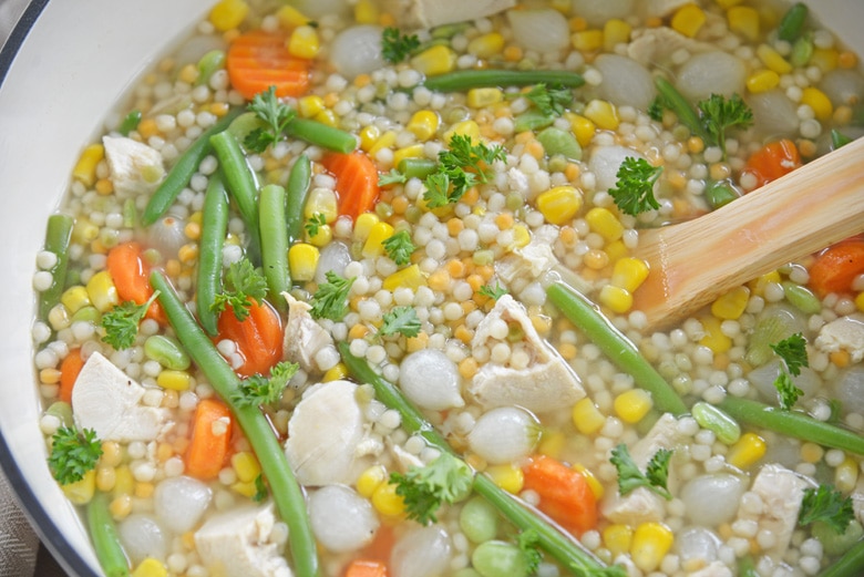 stirring turkey soup on the stove 