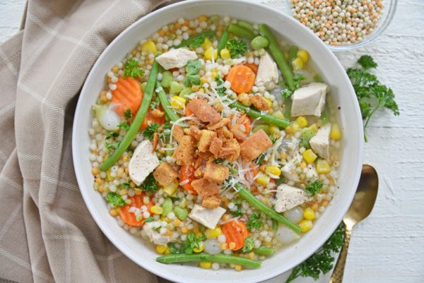 overhead bowl of turkey noodle soup with veggie