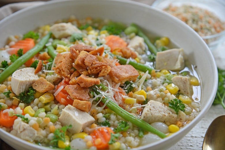angle view of turkey noodle soup with couscous