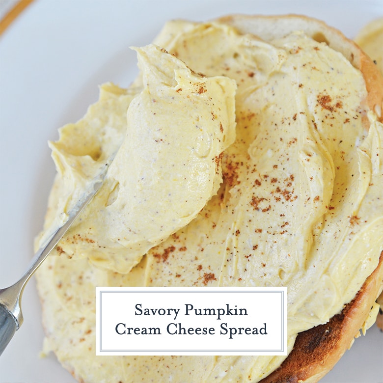 knife spreading pumpkin cream cheese onto a bagel