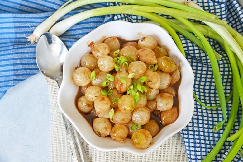 balsamic glazed pearl onions in a serving dish 