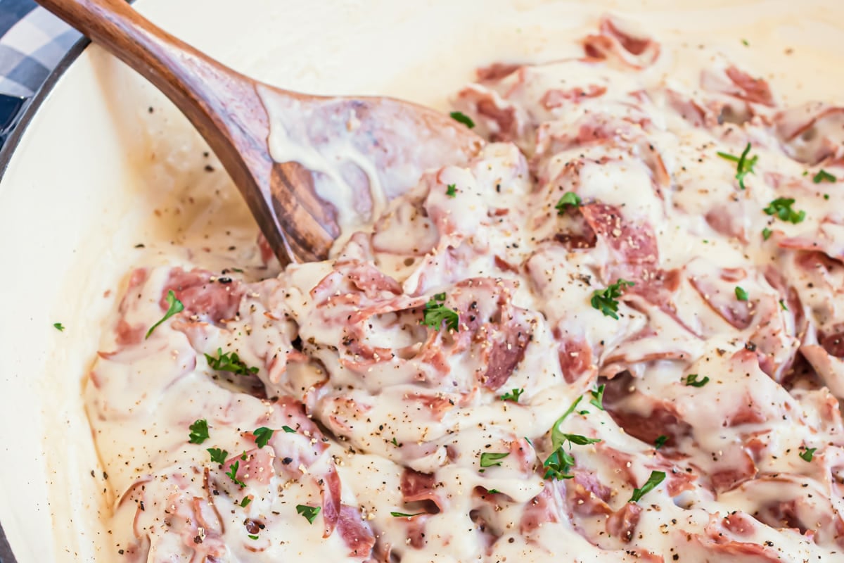 stir creamed chipped beef with a wood spoon 