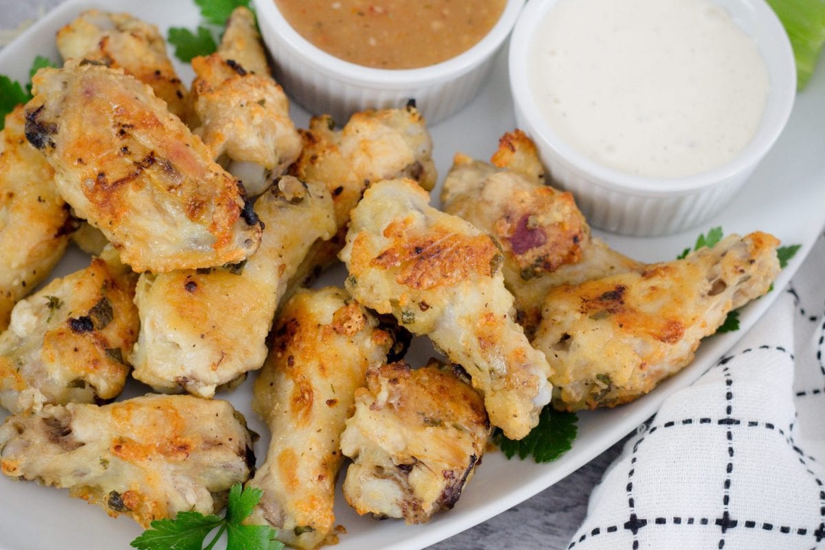 overhead of wing platter with sauces 