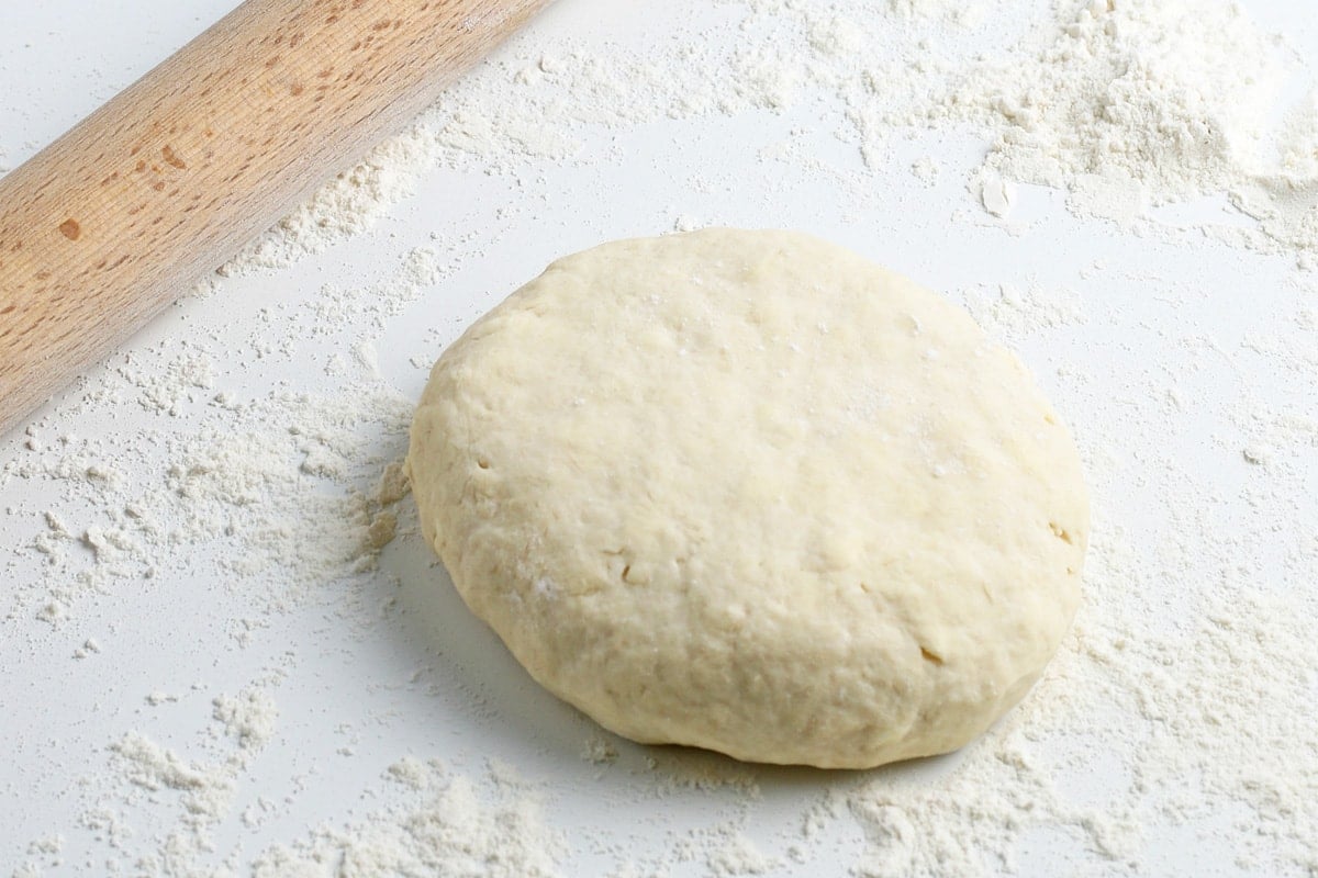 ball of dough on a rolling board 