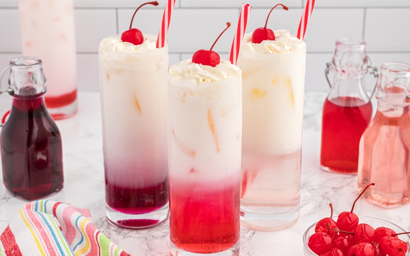head on homemade cream soda with cherry garnish