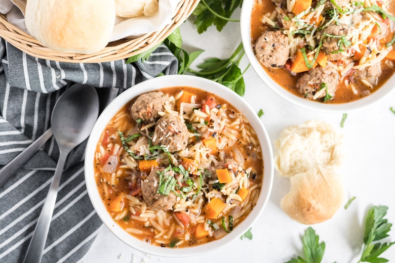 overhead of two bowls with meatball soup 