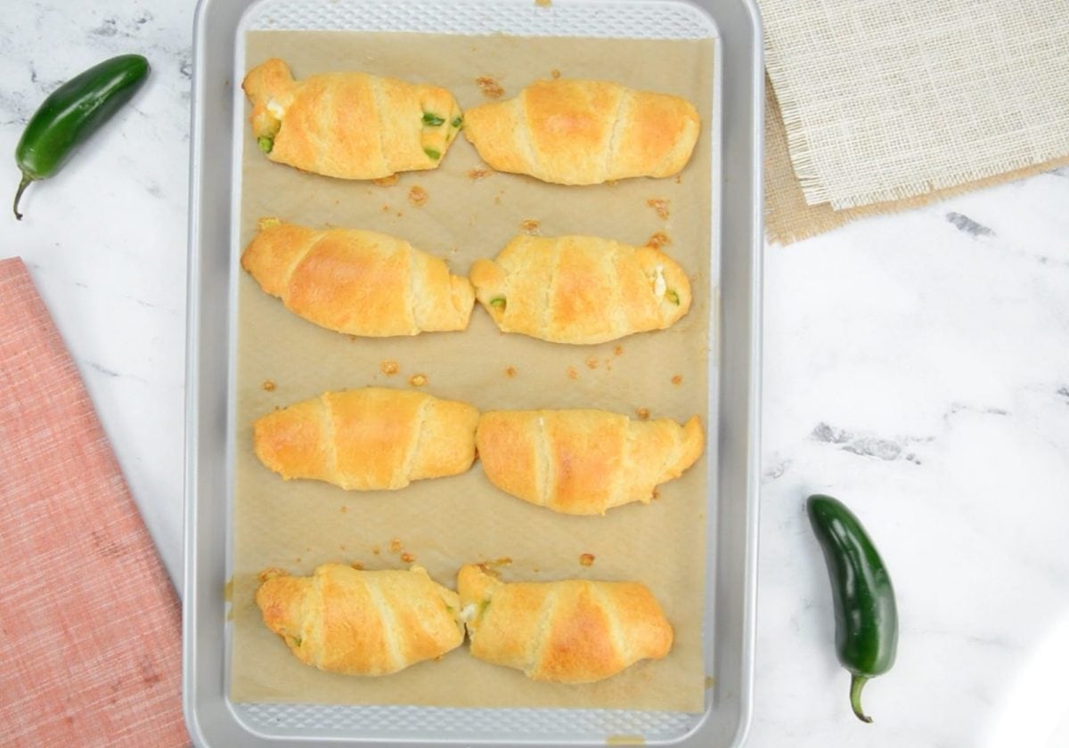 overhead shot of jalapeno popper crescent rolls on sheet pan