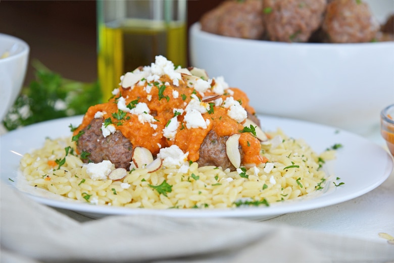 pile of lamb meatballs over orzo 