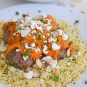 pile of lamb meatballs with romesco sauce