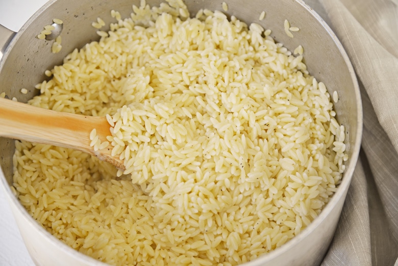 saucepan of cooked and seasoned orzo 