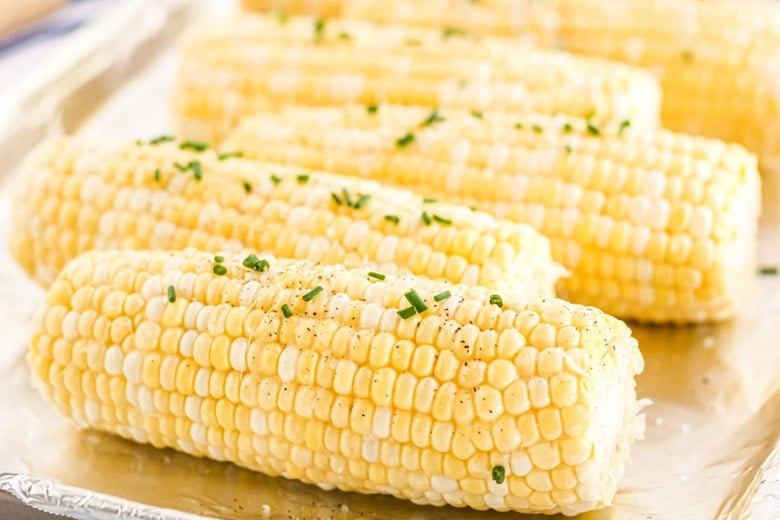 raw corn with salt, pepper and chives 