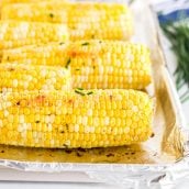 close up of oven roasted corn with chive butter