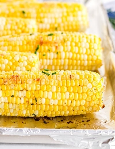close up of oven roasted corn with chive butter