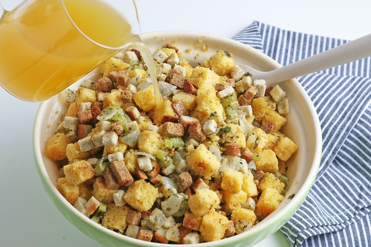 broth pouring into stuffing cubes