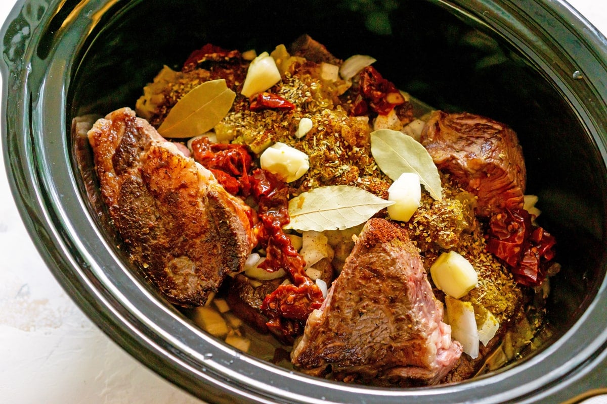 beef barbacoa meat in a slow cooker