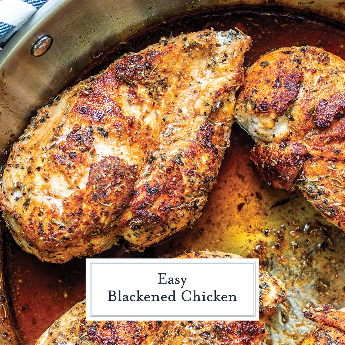 overhead of blackened chicken in a frying pan 