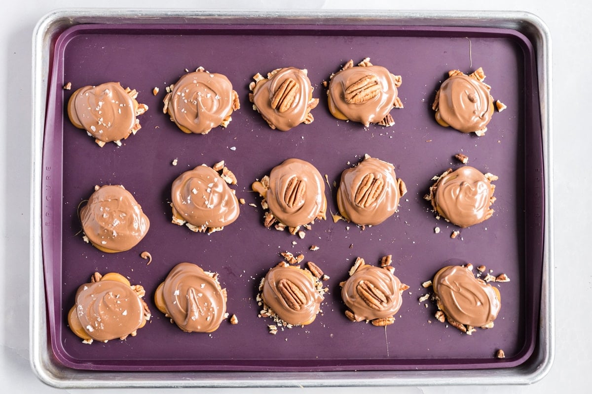 finished chocolate pecans on a baking sheet 